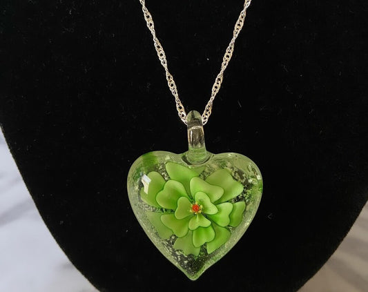 Large green floral Murano style glass heart necklace - glows in the dark