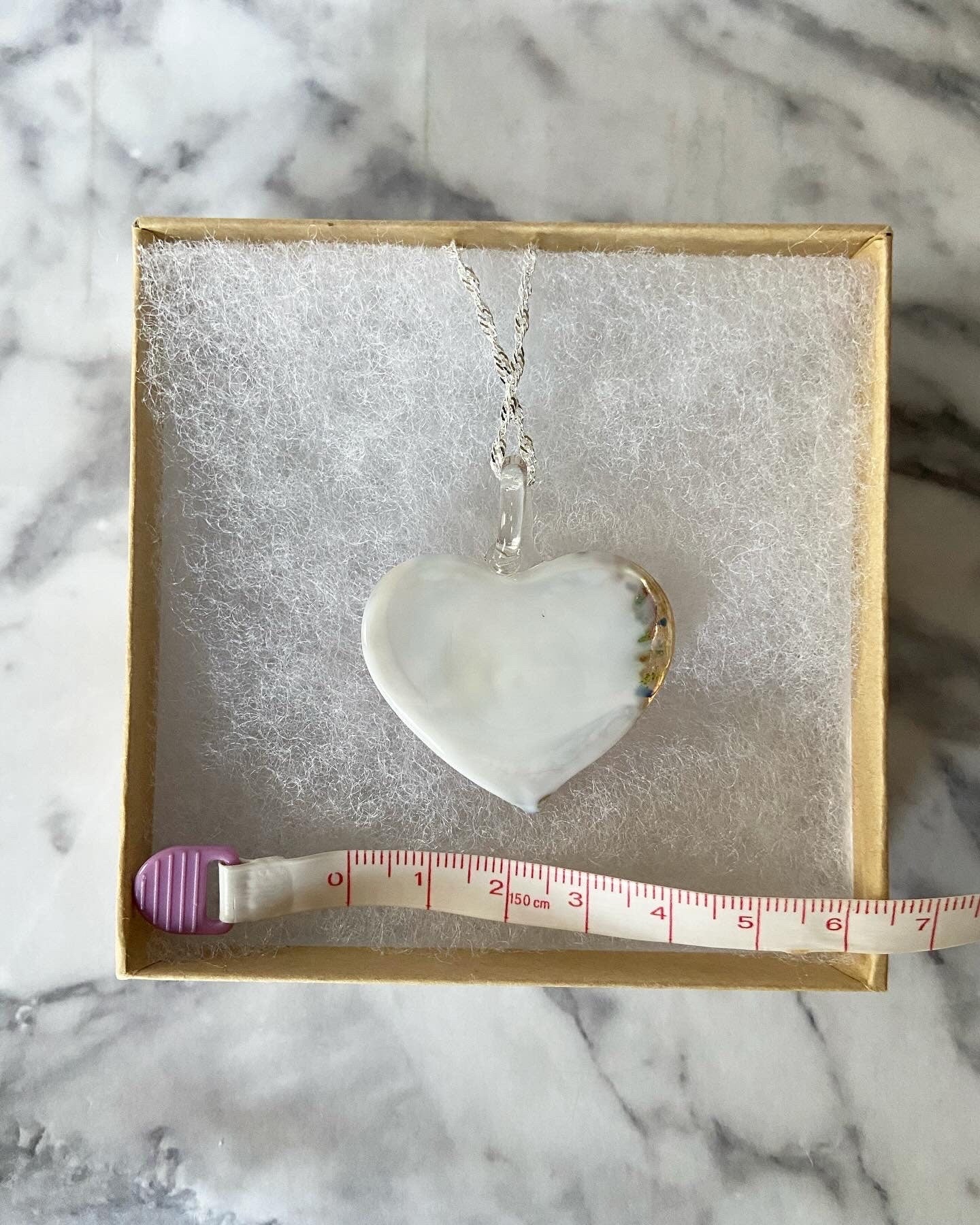 Large light pink calla lily floral with gold glitter on white Murano style heart glass necklace