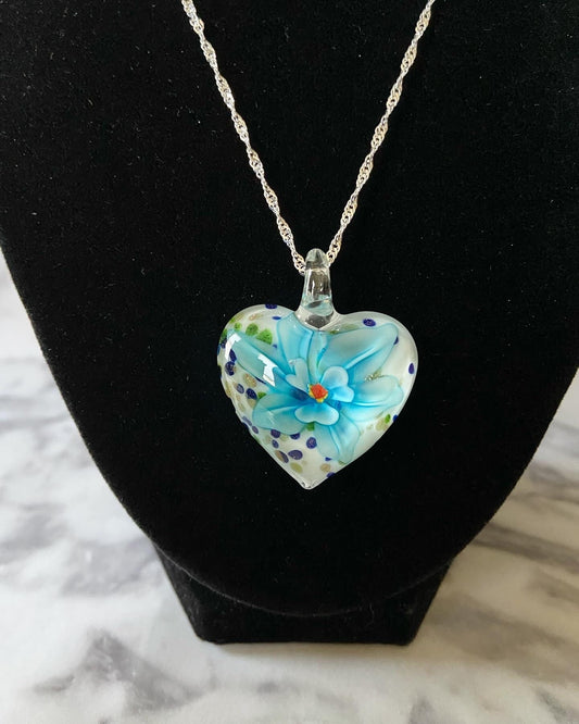 Large light blue floral with gold glitter on white Murano style heart glass necklace