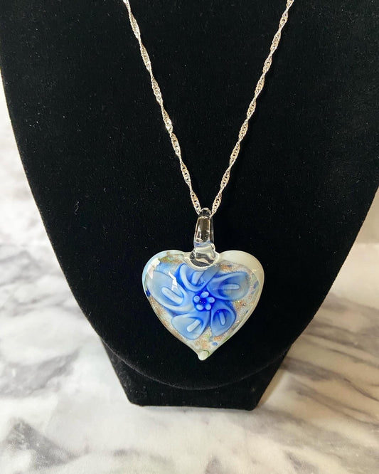 Large royal blue calla lily floral with gold glitter on white Murano style heart glass necklace