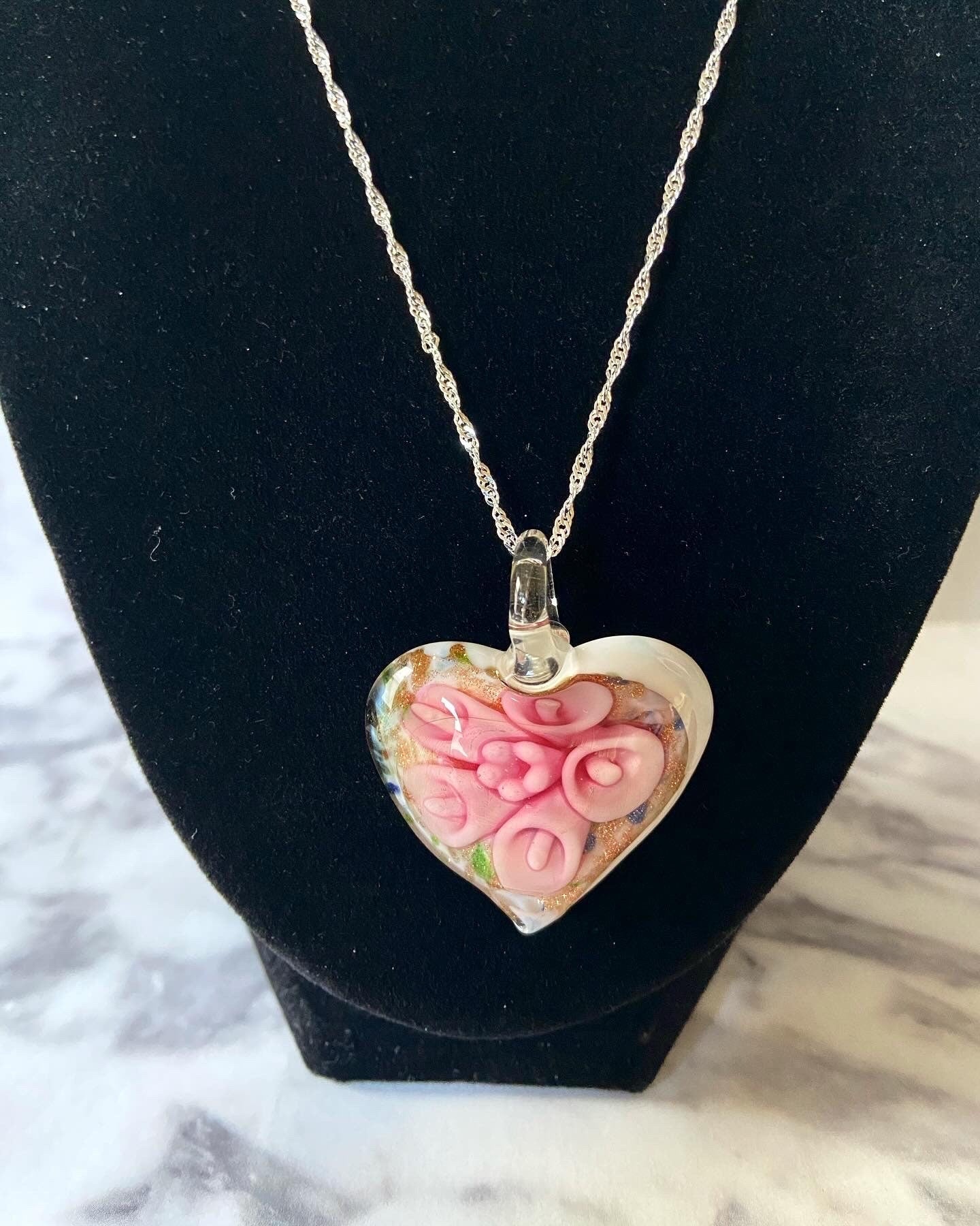 Large light pink calla lily floral with gold glitter on white Murano style heart glass necklace