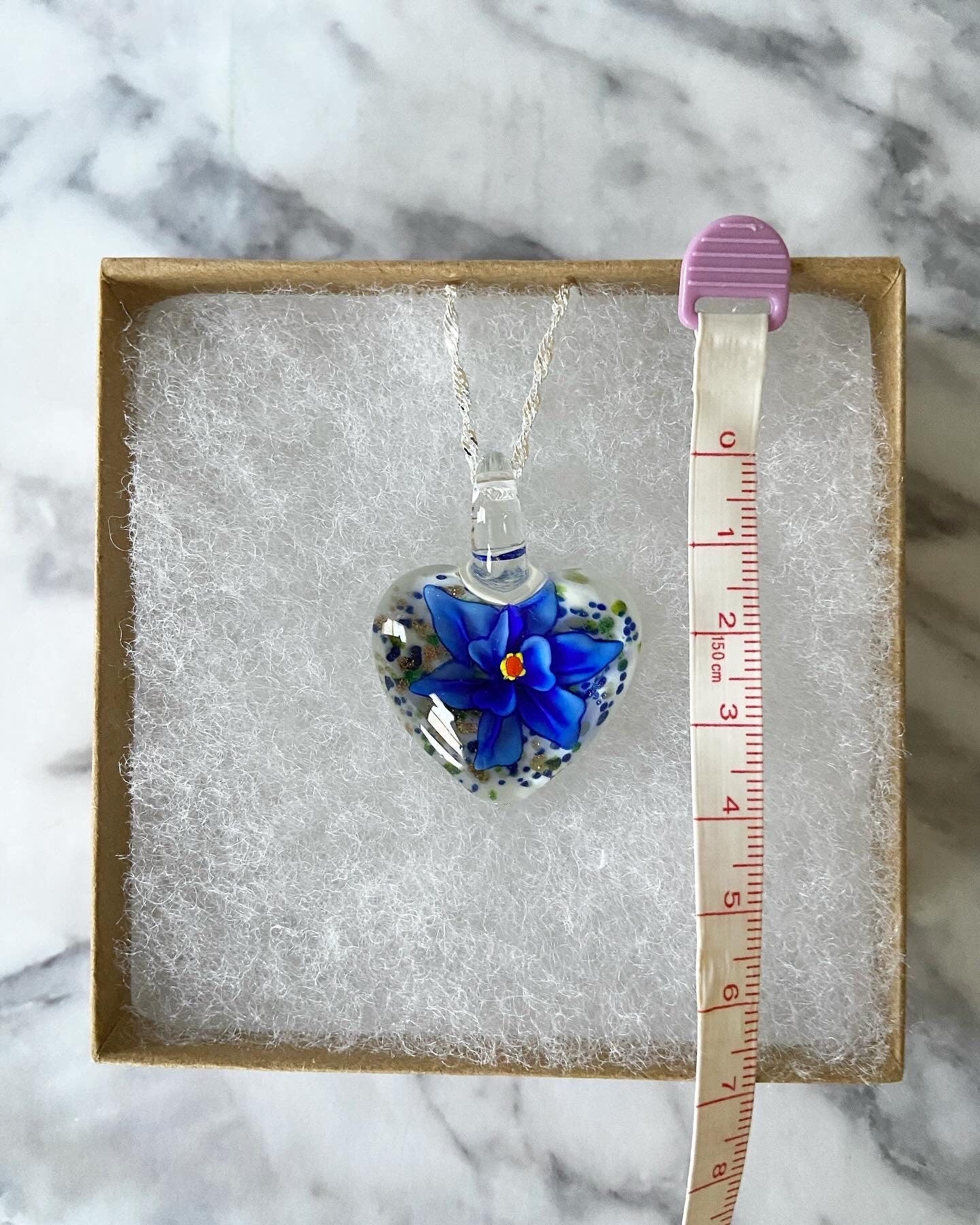 Large cobalt blue floral with gold glitter on white Murano style heart glass necklace