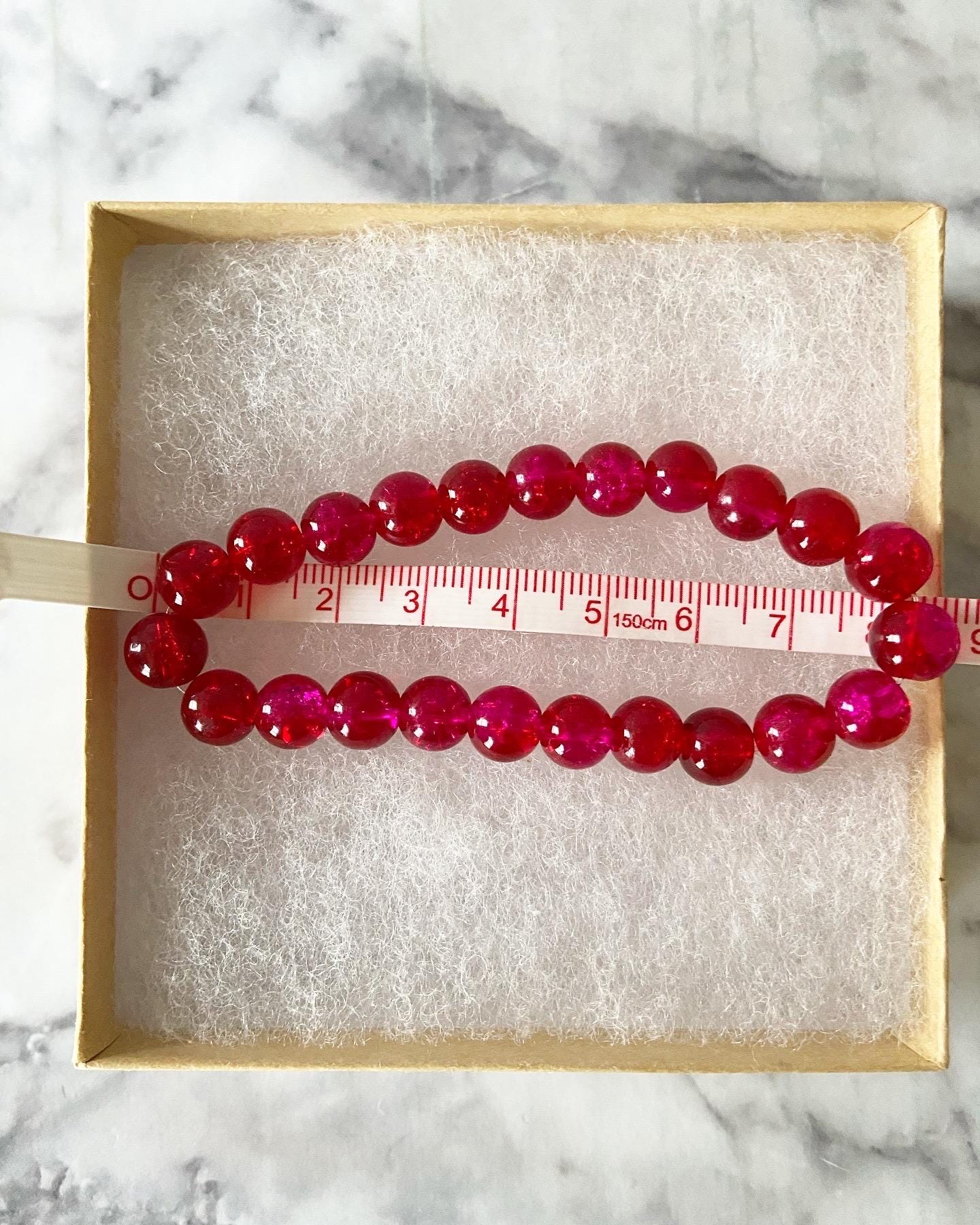 Two-tone red and pink crackle glass stretch bracelet with 8mm round beads