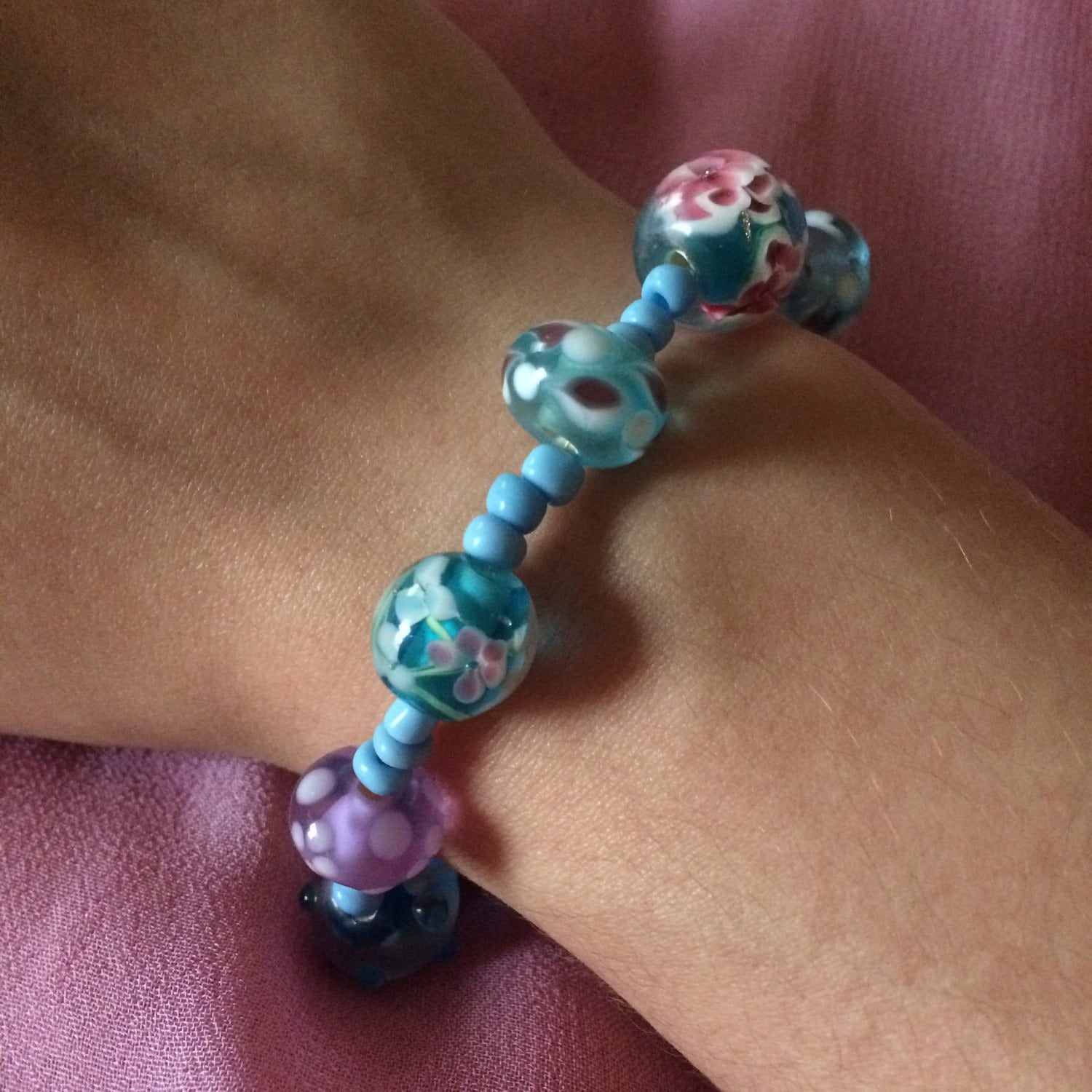 Blue lampwork glass beaded spring flowers stretch bracelet