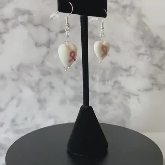 White and pink breast cancer awareness lampwork heart glass drop earrings with light pink crystals on sterling silver traditional hooks