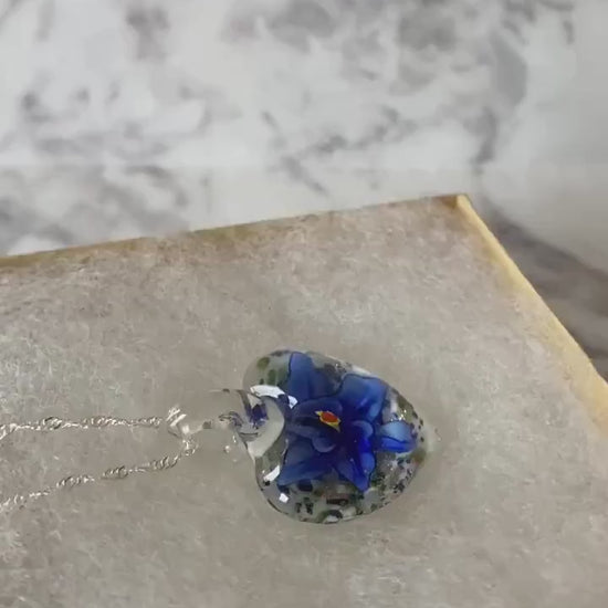 Large cobalt blue floral with gold glitter on white Murano style heart glass necklace