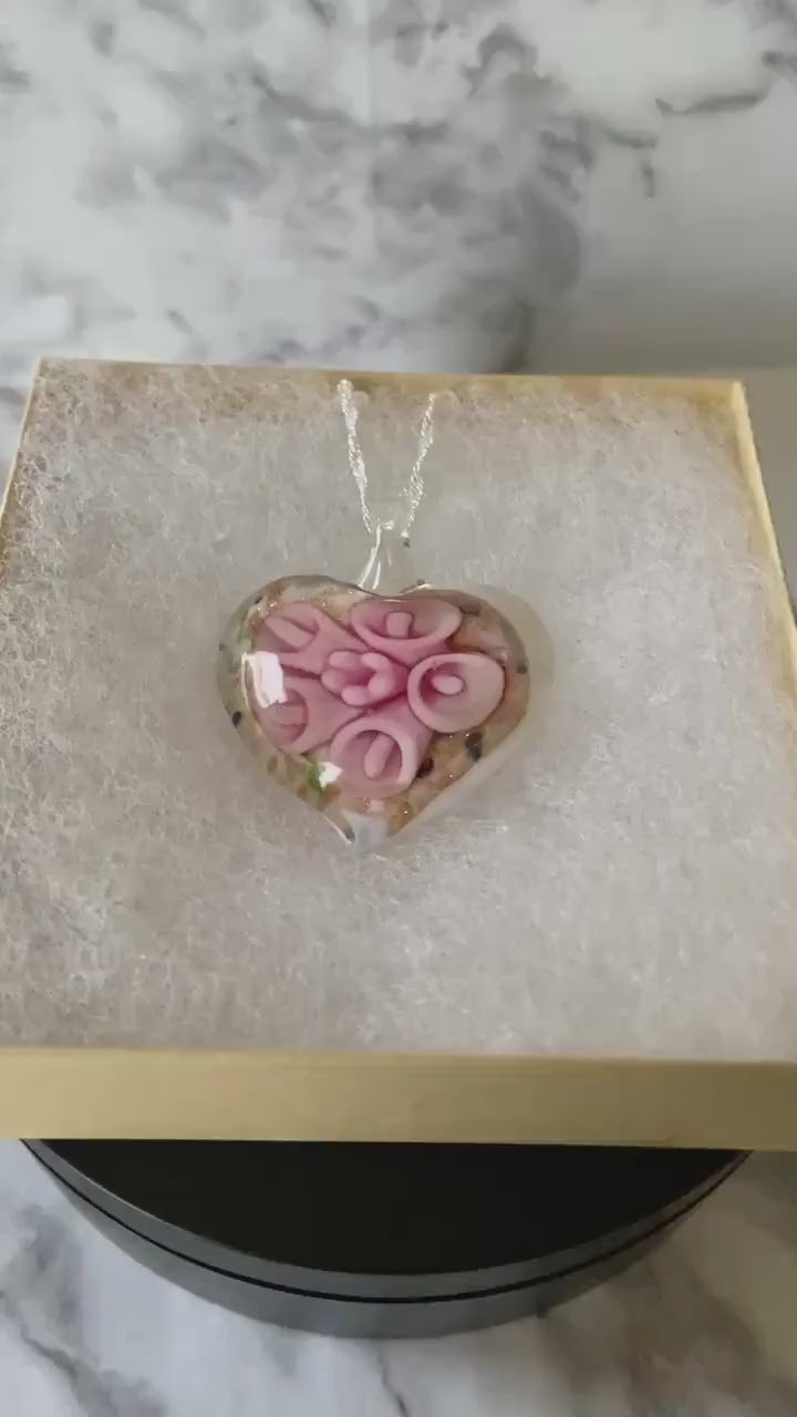 Large light pink calla lily floral with gold glitter on white Murano style heart glass necklace